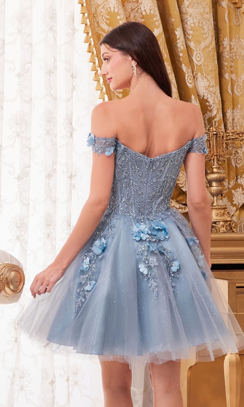 A woman in the Off-Shoulder Short Floral Homecoming Dress CD0194, adorned with 3-D floral embellishments and glitter, stands in an ornate gold and white room.